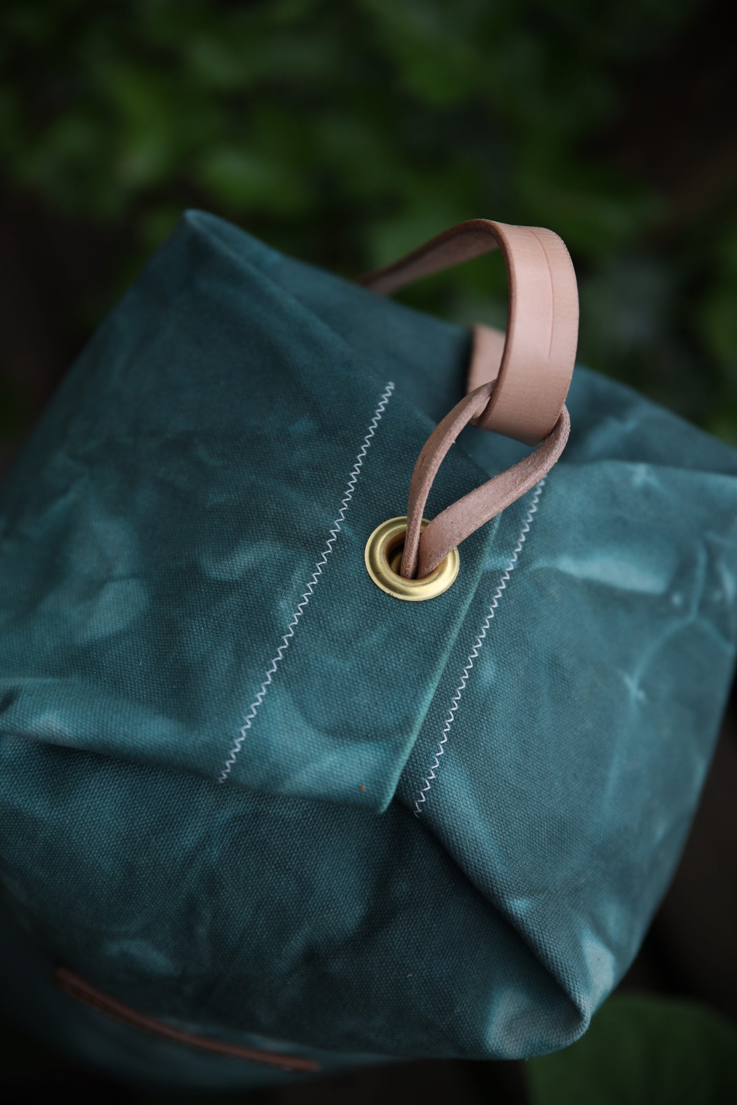 The Runabout in Emerald Waxed Canvas and Veg Tan Leather with Pre-added Patina