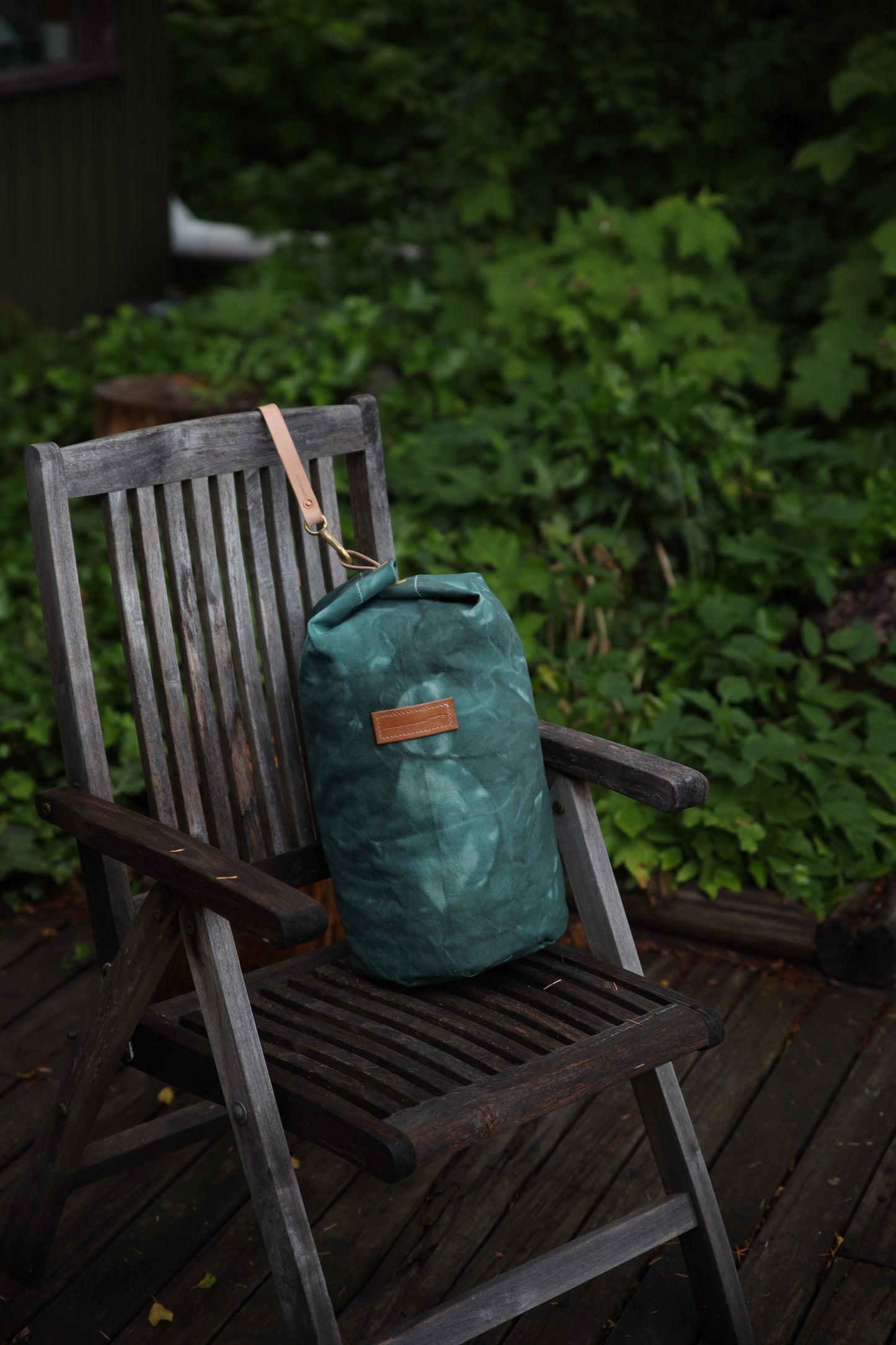 The Runabout in Emerald Waxed Canvas and Veg Tan Leather with Pre-added Patina