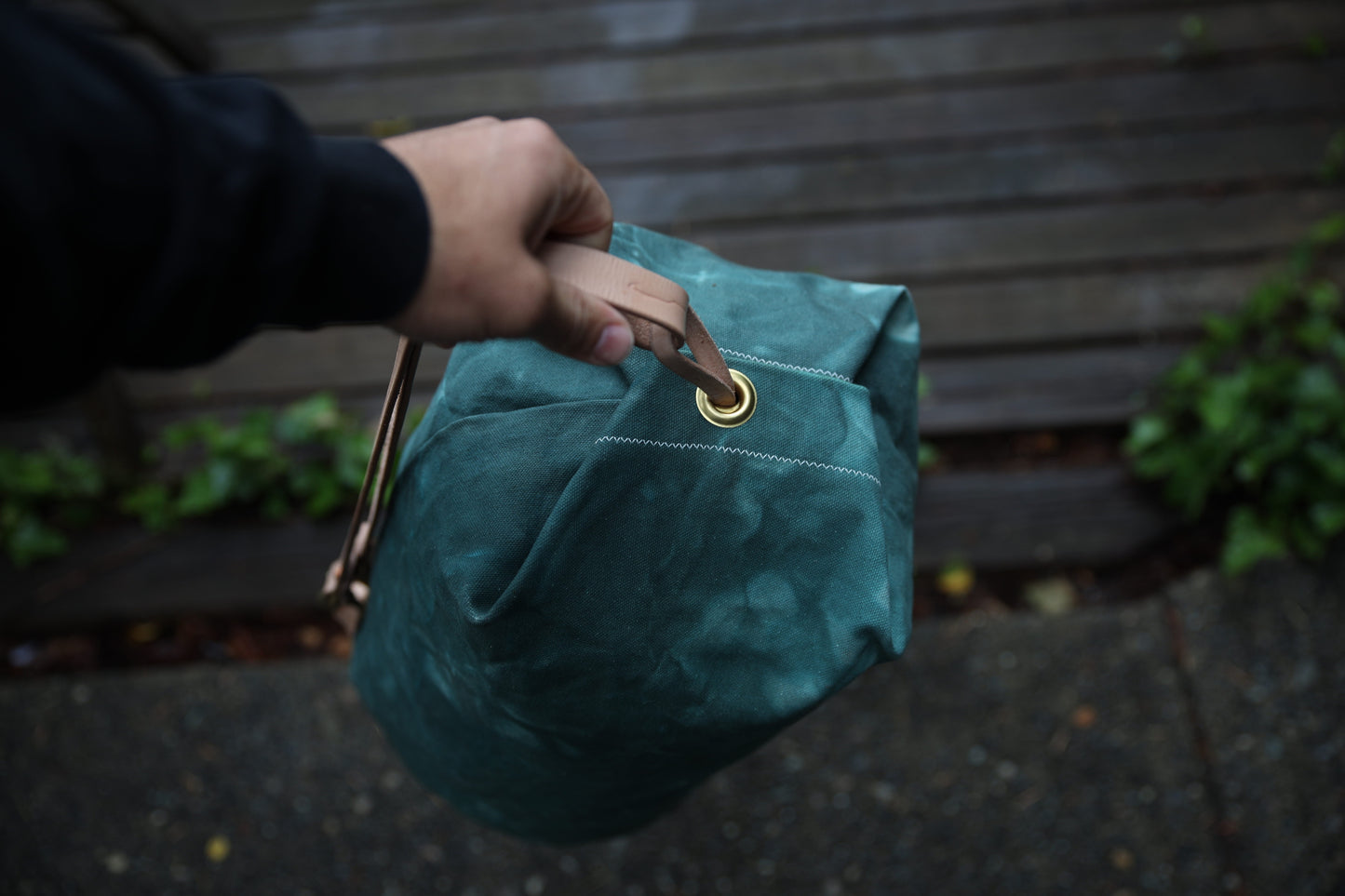 The Runabout in Emerald Waxed Canvas and Veg Tan Leather with Pre-added Patina